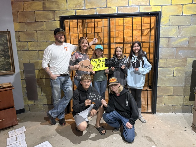 Group posing together after completing an escape room