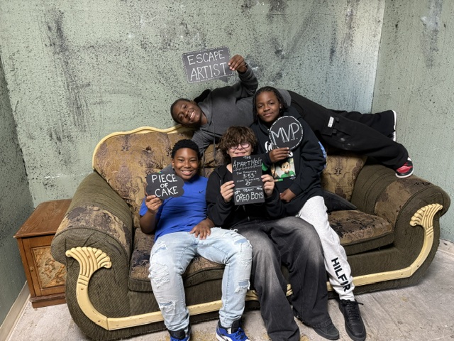 Kids celebrating on the couch after their escape