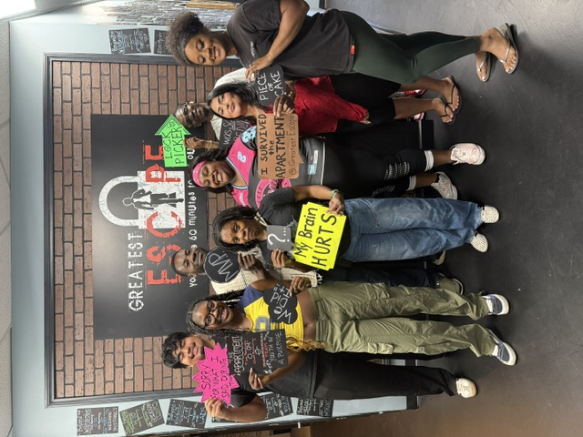 Large group celebrating after their escape room