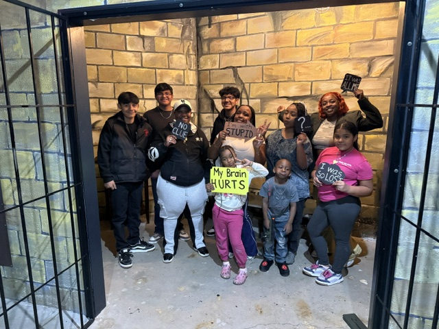 Family celebrating their Greatest Escape experience