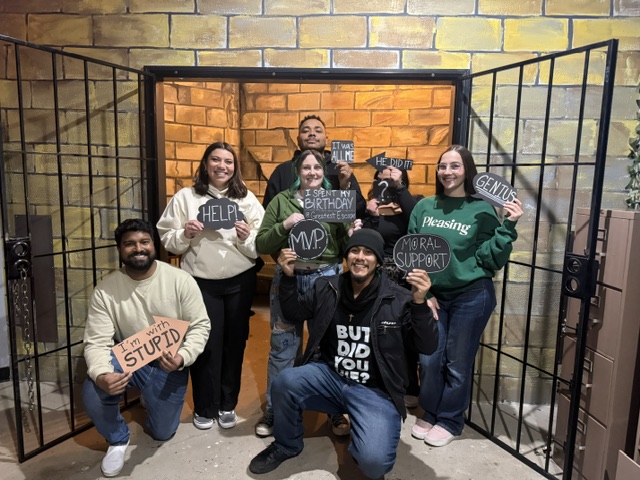 Friends celebrating a successful escape room challenge