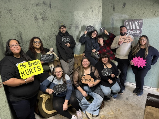Large group celebrating their escape room experience